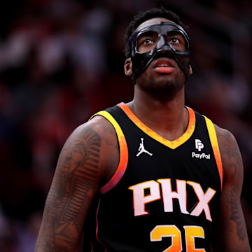 Dec 27, 2023; Houston, Texas, USA; Phoenix Suns forward Nassir Little (25) against the Houston Rockets during the third quarter at Toyota Center. Mandatory Credit: Erik Williams-Imagn Images