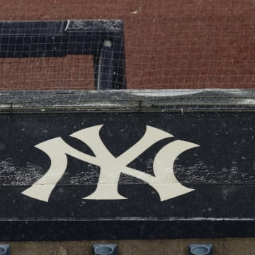 Aug 17, 2020; Bronx, New York,Insider Believes Yankees Should've Made This Impact Move at Trade DeadlineUSA; A general view of rain falling on the  New York Yankees logo on the first base dugout roof during a rain delay in the game between the New York Yankees and the Boston Red Sox. Mandatory Credit: Vincent Carchietta-USA TODAY Sports