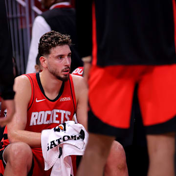 Oct 27, 2025; Houston, Texas, USA; Houston Rockets center Alperen Sengun (28) sits on the bench during a timeout against the Brooklyn Nets during the second quarter at Toyota Center. Mandatory Credit: Erik Williams-Imagn Images

