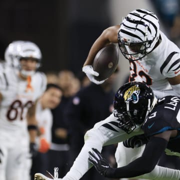 Jacksonville Jaguars linebacker Devin Lloyd (33) tackles Cincinnati Bengals wide receiver Tyler Boyd (83) out of bounds during the second quarter of a regular season NFL football matchup Monday, Dec. 4, 2023 at EverBank Stadium in Jacksonville, Fla. [Corey Perrine/Florida Times-Union]