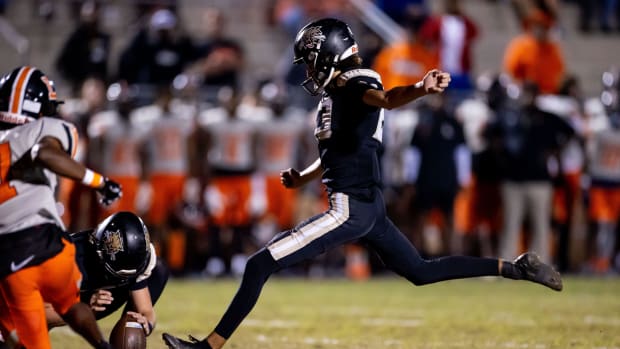 Buchholz Bobcats kicker Jay Giunta (23) kicks a point after touchdown during the first half against the Lakeland Dreadnaughts