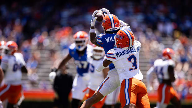 Florida Gators wide receiver Eugene Wilson III (3) catches a pass over Florida Gators defensive back Jason Marshall Jr. (3) d