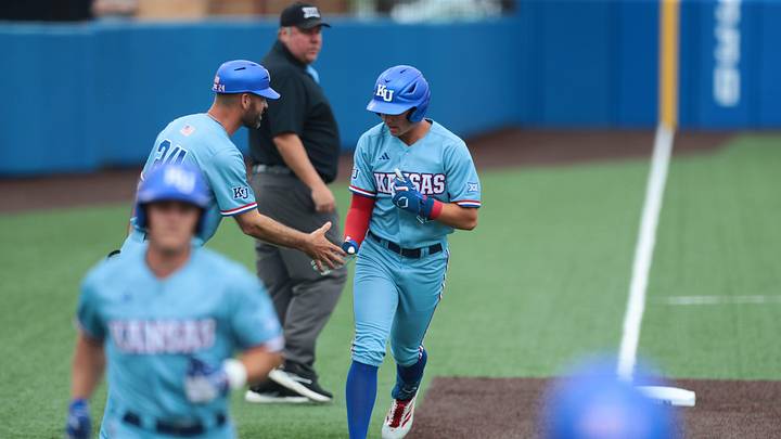 Kansas junior Tyson LeBlanc (2) runs the bases after a home run 