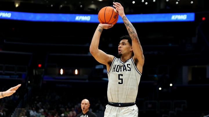 Nov 30, 2024; Washington, District of Columbia, USA; Georgetown Hoyas guard Micah Peavy (5) shoots the ball against the Albany Great Danes during the first half at Capital One Arena. Mandatory Credit: Daniel Kucin Jr.-Imagn Images