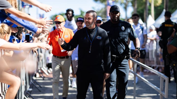 Florida Gators head coach Billy Napier shakes hands with fans during Gator Walk at the Orange and Blue spring football game at Steve Spurrier Field at Ben Hill Griffin Stadium in Gainesville, FL on Saturday, April 13, 2024. [Matt Pendleton/Gainesville Sun]