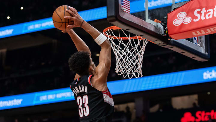 Mar 27, 2024; Atlanta, Georgia, USA; Portland Trail Blazers forward Toumani Camara (33) dunks against Atlanta Hawks during the second quarter at State Farm Arena. Mandatory Credit: Jordan Godfree-USA TODAY Sports