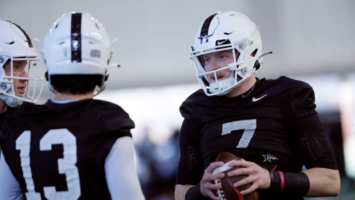 Oklahoma State's Alan Bowman talks with Garret Rangel during an Oklahoma State University Cowboys spring football practice in Stillwater, Okla., Tuesday, March 26, 2024.