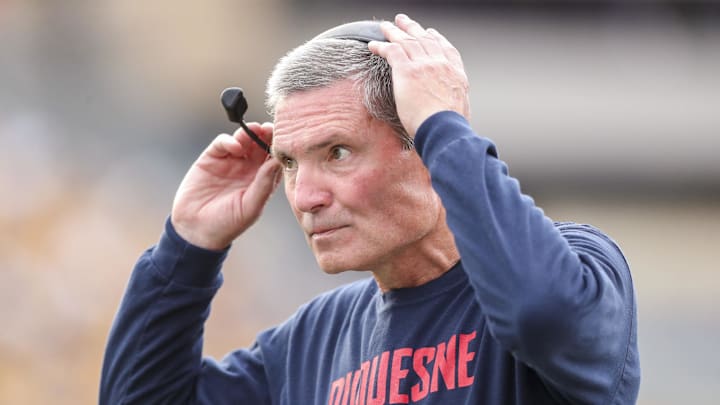 Sep 9, 2023; Morgantown, West Virginia, USA; Duquesne Dukes head coach Jerry Schmitt along the sidelines during the first quarter against the West Virginia Mountaineers at Mountaineer Field at Milan Puskar Stadium. Mandatory Credit: Ben Queen-Imagn Images