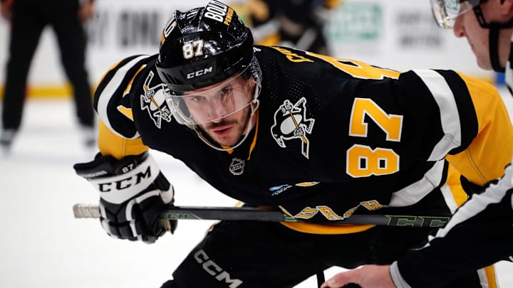 Apr 11, 2024; Pittsburgh, Pennsylvania, USA;  Pittsburgh Penguins center Sidney Crosby (87) prepares to take a face-off against the Detroit Red Wings during the first period at PPG Paints Arena. Mandatory Credit: Charles LeClaire-Imagn Images