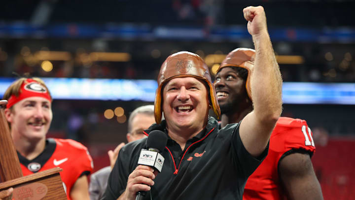 Aug 31, 2024; Atlanta, Georgia, USA; Georgia Bulldogs head coach Kirby Smart wears the old leather helmet after a victory over the Clemson Tigers at Mercedes-Benz Stadium. Mandatory Credit: Brett Davis-Imagn Images