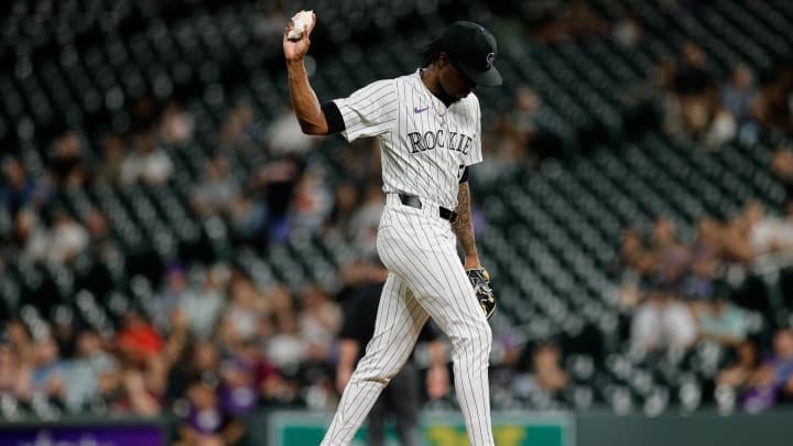 Aug 27, 2024; Denver, Colorado, USA; Colorado Rockies relief pitcher Angel Chivilli (57) reacts after giving up a three run home run in the ninth inning against the Miami Marlins at Coors Field.