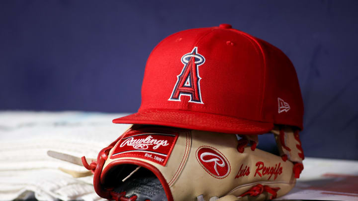Aug 1, 2023; Atlanta, Georgia, USA; A detailed view of a Los Angeles Angels hat and glove on the bench against the Atlanta Braves in the eighth inning at Truist Park. Mandatory Credit: Brett Davis-USA TODAY Sports