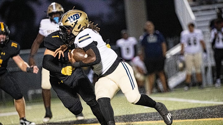 Javian Mallory, a running back for West Boca Raton runs for yards against Bishop Verot High School on Friday, Oct. 18, 2024. West Boca Raton won. Javian Mallory, a running back for West Boca Raton runs for yards against Bishop Verot High School on Friday, Oct. 18, 2024. West Boca Raton won.