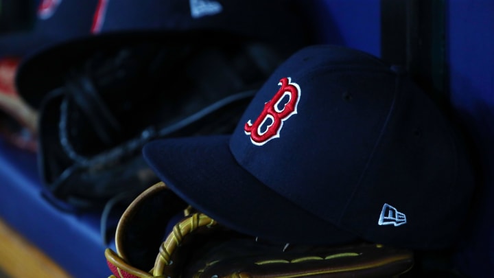 Jul 22, 2019; St. Petersburg, FL, USA; A detail view of Boston Red Sox hat and glove laying in the dugout at Tropicana Field. Mandatory Credit: Kim Klement-USA TODAY Sports