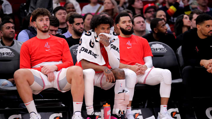 Dec 27, 2023; Houston, Texas, USA; (from L-to-R) Houston Rockets center Alperen Sengun (28), Houston Rockets guard Jalen Green (4) and Houston Rockets guard Fred VanVleet (5) sit on the bench during the fourth quarter against the Phoenix Suns at Toyota Center. Mandatory Credit: Erik Williams-USA TODAY Sports