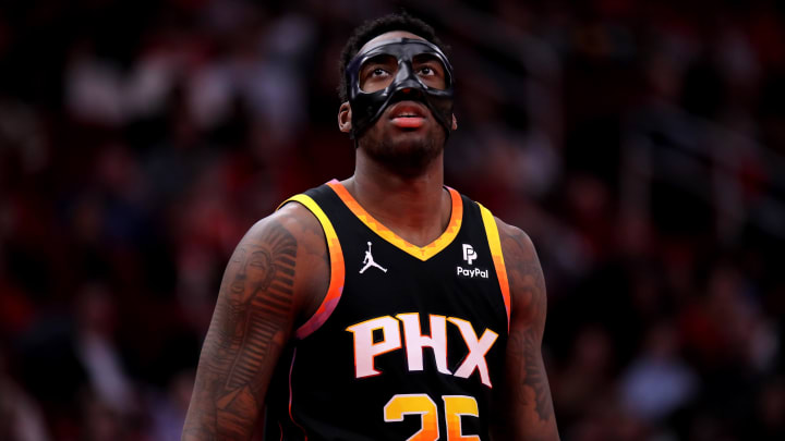 Dec 27, 2023; Houston, Texas, USA; Phoenix Suns forward Nassir Little (25) against the Houston Rockets during the third quarter at Toyota Center. Mandatory Credit: Erik Williams-USA TODAY Sports