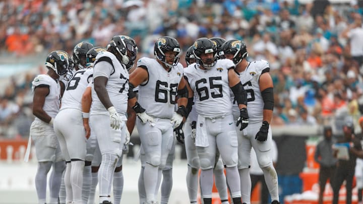 Sep 15, 2024; Jacksonville, Florida, USA; Jacksonville Jaguars offensive line Anton Harrison (77), offensive line Brandon Scherff (68), and offensive line Mitch Morse (65) wait to line up for the drive against the Cleveland Browns during the third quarter at EverBank Stadium. Mandatory Credit: Morgan Tencza-Imagn Images Sep 15, 2024; Jacksonville, Florida, USA; Jacksonville Jaguars offensive line Anton Harrison (77), offensive line Brandon Scherff (68), and offensive line Mitch Morse (65) wait to line up for the drive against the Cleveland Browns during the third quarter at EverBank Stadium. Mandatory Credit: Morgan Tencza-Imagn Images