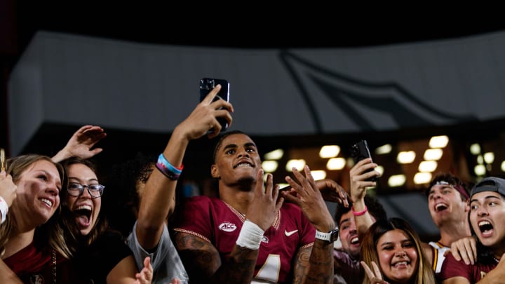 Nov 18, 2023; Tallahassee, Florida, USA; Florida State Seminoles wide receiver Keon Coleman (4) celebrates the win against the North Alabama Lions with fans at Doak S. Campbell Stadium. Mandatory Credit: Morgan Tencza-USA TODAY Sports