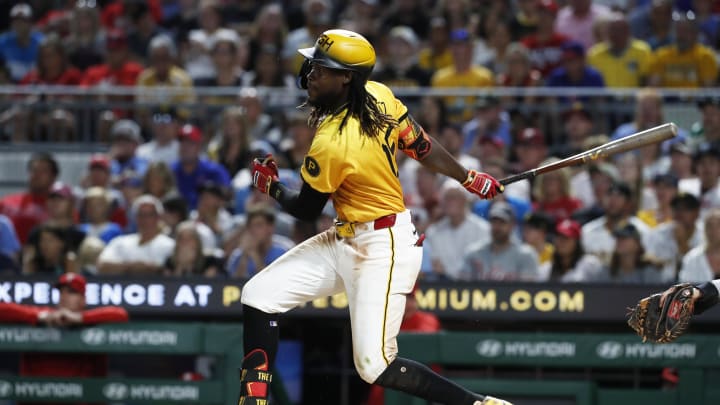 Jul 19, 2024; Pittsburgh, Pennsylvania, USA;  Pittsburgh Pirates shortstop Oneil Cruz (15) hits an RBI single against the Philadelphia Phillies during the ninth inning at PNC Park. Pittsburgh won 8-7. Mandatory Credit: Charles LeClaire-USA TODAY Sports