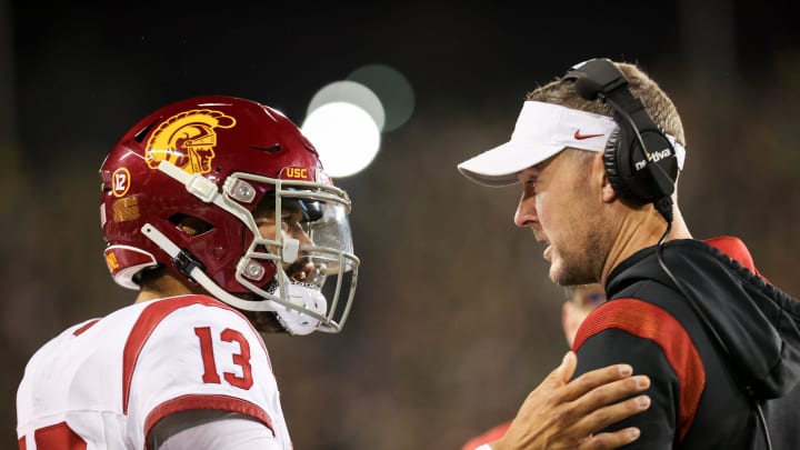 USC Trojans quarterback Caleb Williams talks with USC Trojans head coach Lincoln Riley during the