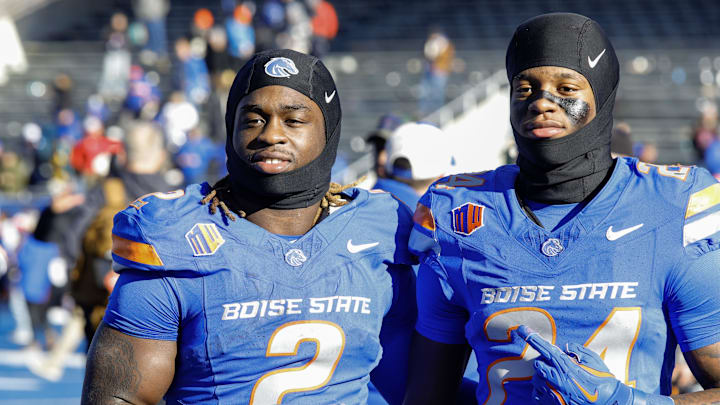 Boise State Broncos running back Ashton Jeanty (2) and running back Dylan Riley (24) celebrate after the game against the Oregon State Beavers at Albertsons Stadium on November 29. 2024. Boise State Broncos running back Ashton Jeanty (2) and running back Dylan Riley (24) celebrate after the game against the Oregon State Beavers at Albertsons Stadium on November 29. 2024.