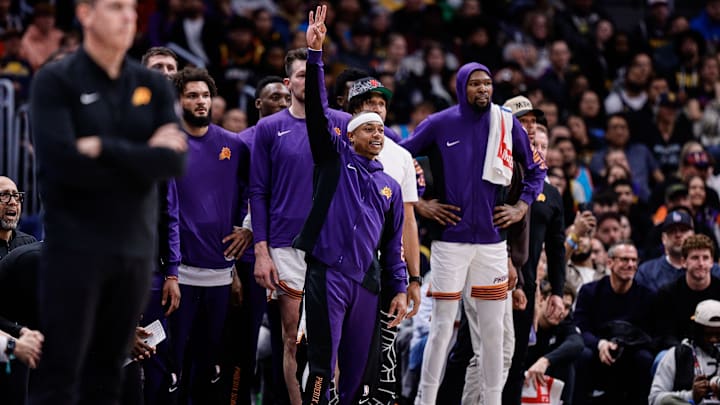 Isaiah Thomas on the Phoenix Suns bench in 2024. 