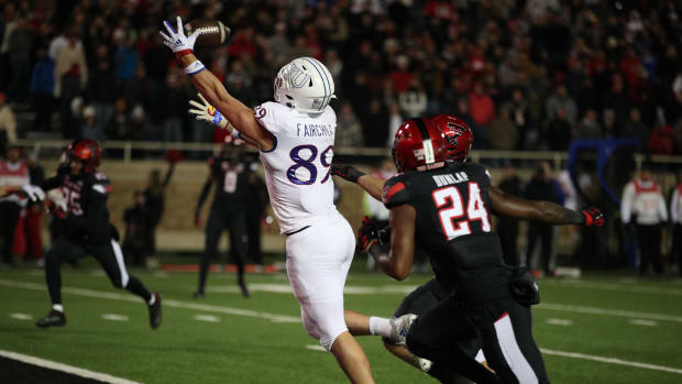 Kansas Jayhawks tight end Mason Fairchild (89) reaches for a pass against the Texas Tech Red Raiders 