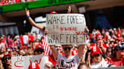 Oct 5, 2024; Raleigh, North Carolina, USA; North Carolina State Wolfpack fan with a sign during the first half of the game against Wake Forest Demon Deacons at Carter-Finley Stadium. Mandatory Credit: Jaylynn Nash-Imagn Images