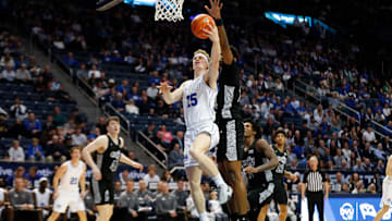 Richie Saunders attacks the rim against Cincinnati