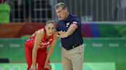USA head coach Geno Auriemma talks with USA guard Diana Taurasi.