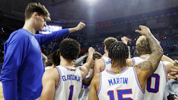 Florida Gators guard Walter Clayton Jr. (1) and center Olivier Rioux (32)