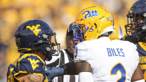West Virginia Mountaineers wide receiver Rodney Gallagher III (24) and Pittsburgh Panthers linebacker Rasheem Biles (3)