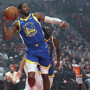 Oct 24, 2025; Portland, Oregon, USA;  Golden State Warriors forward Jonathan Kuminga (1) passes the ball against the Portland Trail Blazers in the first half at Moda Center. Mandatory Credit: Jaime Valdez-Imagn Images