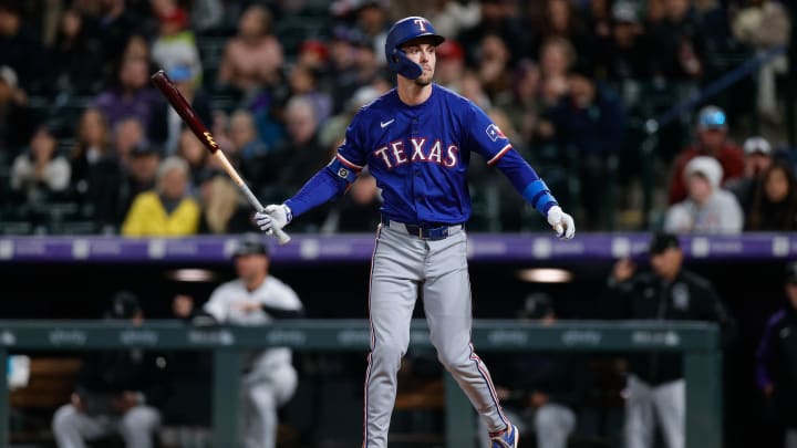 May 10, 2024; Denver, Colorado, USA; Texas Rangers outfielder Evan Carter (32) after striking out in the eighth inning against the Colorado Rockies at Coors Field. Mandatory Credit: Isaiah J. Downing-USA TODAY Sports