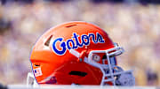 Oct 16, 2021; Baton Rouge, Louisiana, USA; Florida Gators helmet on a water jug during the game against LSU Tigers during the first half  at Tiger Stadium. Mandatory Credit: Stephen Lew-Imagn Images