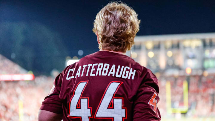 Sep 27, 2025; Raleigh, N.C.; A fan of Virginia Tech linebacker Brett Clatterbaugh (44) fan takes in the game between the Hokies and N.C. State. Sep 27, 2025; Raleigh, N.C.; A fan of Virginia Tech linebacker Brett Clatterbaugh (44) fan takes in the game between the Hokies and N.C. State.