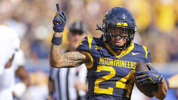 Sep 13, 2025; Morgantown, West Virginia, USA; West Virginia Mountaineers wide receiver Rodney Gallagher III (24) celebrates a first down after a catch during the first quarter against the Pittsburgh Panthers at Milan Puskar Stadium. Mandatory Credit: Ben Queen-Imagn Images