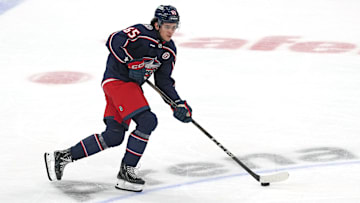 Blue Jackets center Luca del bel Belluz skates with the puck.