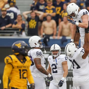 Penn State Nittany Lions tight end Tyler Warren (44) celebrates with teammates after catching a touchdown pass against the West Virginia Mountaineers. 