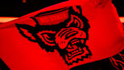 Nov 22, 2024; Raleigh, North Carolina, USA;  North Carolina State Wolfpack flag prior to the first half of the game against the William & Mary Tribe at Lenovo Center. Mandatory Credit: Jaylynn Nash-Imagn Images