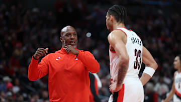 Mar 9, 2025; Portland, Oregon, USA;  Portland Trail Blazers head coach Chauncey Billups talks with Trail Blazers’ forward Toumani Camara (33) during a time out in the first half at Moda Center. Mandatory Credit: Jaime Valdez-Imagn Images