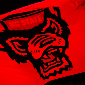 Nov 22, 2024; Raleigh, North Carolina, USA;  North Carolina State Wolfpack flag prior to the first half of the game against the William & Mary Tribe at Lenovo Center. Mandatory Credit: Jaylynn Nash-Imagn Images