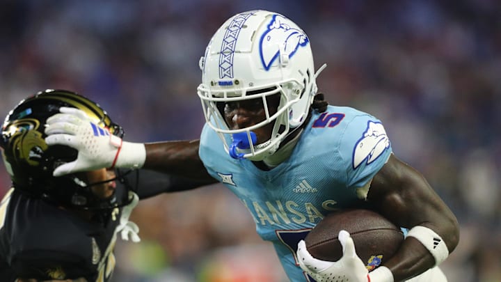 Kansas Jayhawks wide receiver Doug Emilien (5) makes a block on the Lindenwood Lions to score a touchdown in the fourth quarter of the game, Thursday, August 29, 202,4 at Children's Mercy Park.