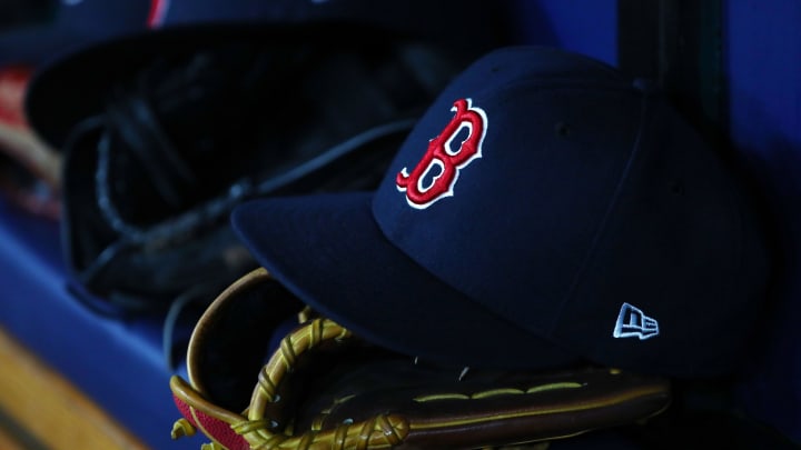 Jul 22, 2019; St. Petersburg, FL, USA; A detail view of Boston Red Sox hat and glove laying in the dugout at Tropicana Field. Mandatory Credit: Kim Klement-USA TODAY Sports