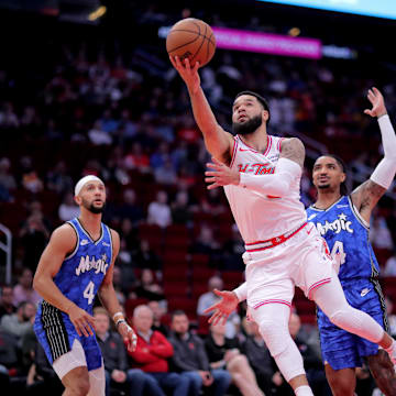 Apr 9, 2024; Houston, Texas, USA; Houston Rockets guard Fred VanVleet (5) makes a layup against the Orlando Magic