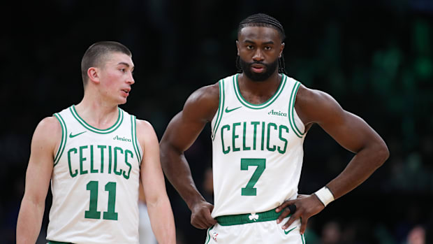 Boston Celtics forward Jaylen Brown (7) and Boston Celtics guard Payton Pritchard (11) talk during the first half