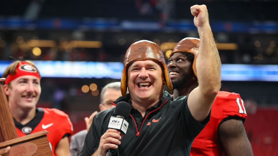 Georgia Bulldogs head coach Kirby Smart wears the old leather helmet after a victory over the Clemson Tigers. | Brett Davis-USA TODAY Sports