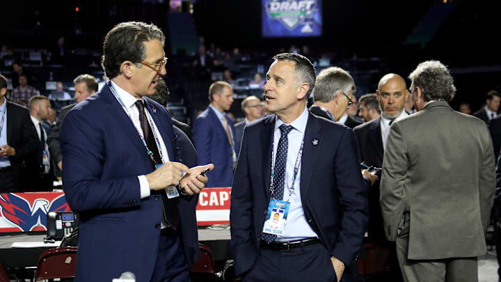 Brendan Shanahan, and Laurence Gilman in discussion at the 2019 NHL Draft