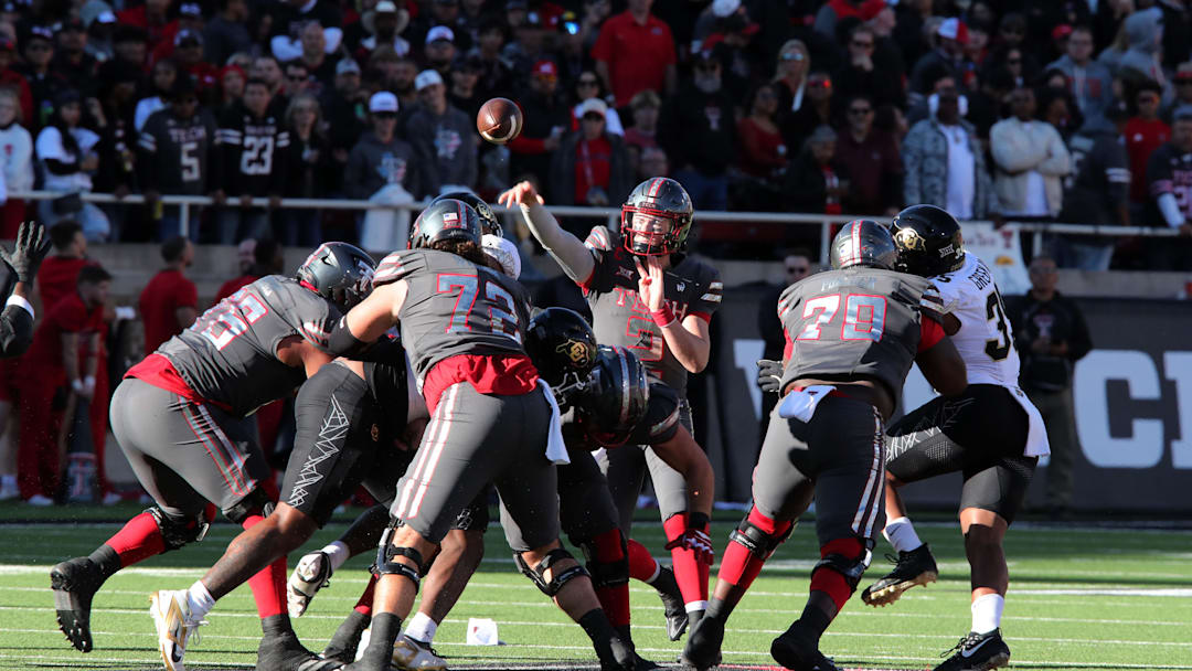 Nov 9, 2024; Lubbock, Texas, USA; Texas Tech Red Raiders quarterback Behren Morton (2) passes against the Colorado Buffalos in the first half at Jones AT&T Stadium and Cody Campbell Field. Mandatory Credit: Michael C. Johnson-Imagn Images
