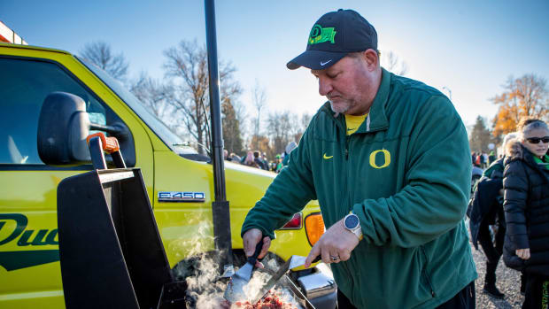 Steve Patterson, of McMinnville, cooks up Philly cheesesteaks at his    quackulance tailgate 